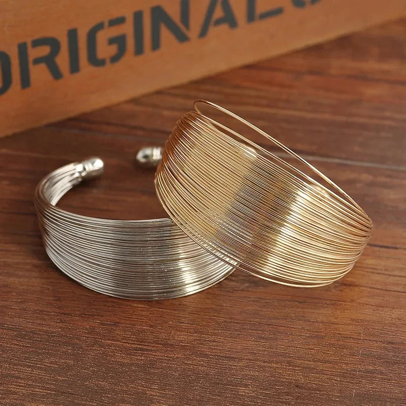 Brazalete Trenzado Ancho Tono Oro - Nora