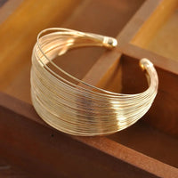 Brazalete Trenzado Ancho Tono Oro - Nora